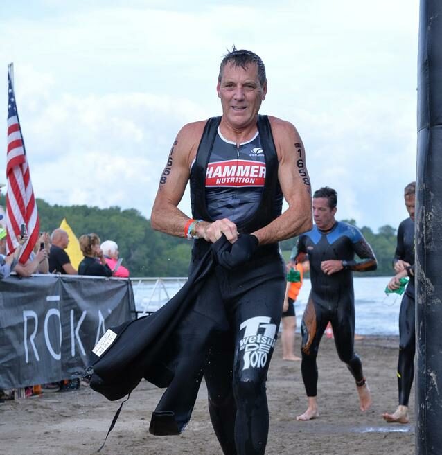 Tony Schiller exiting the swim in Lake Erie at the 2019 USAT National Championship for the Olympic distance triathlon.