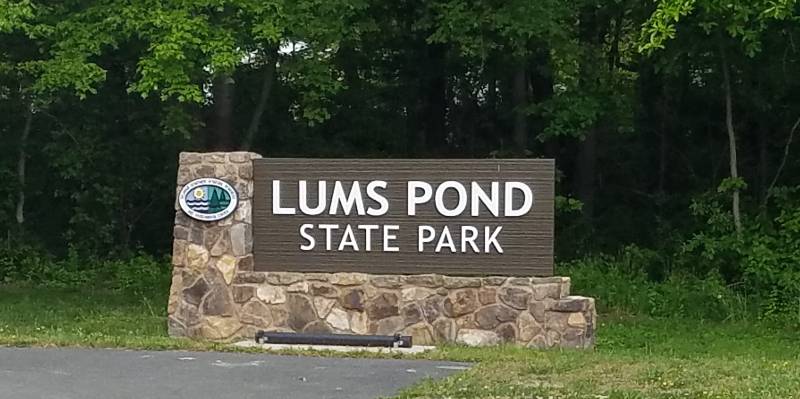 Sign at the entrance of Lums Pond State Park in Bear, Delaware.