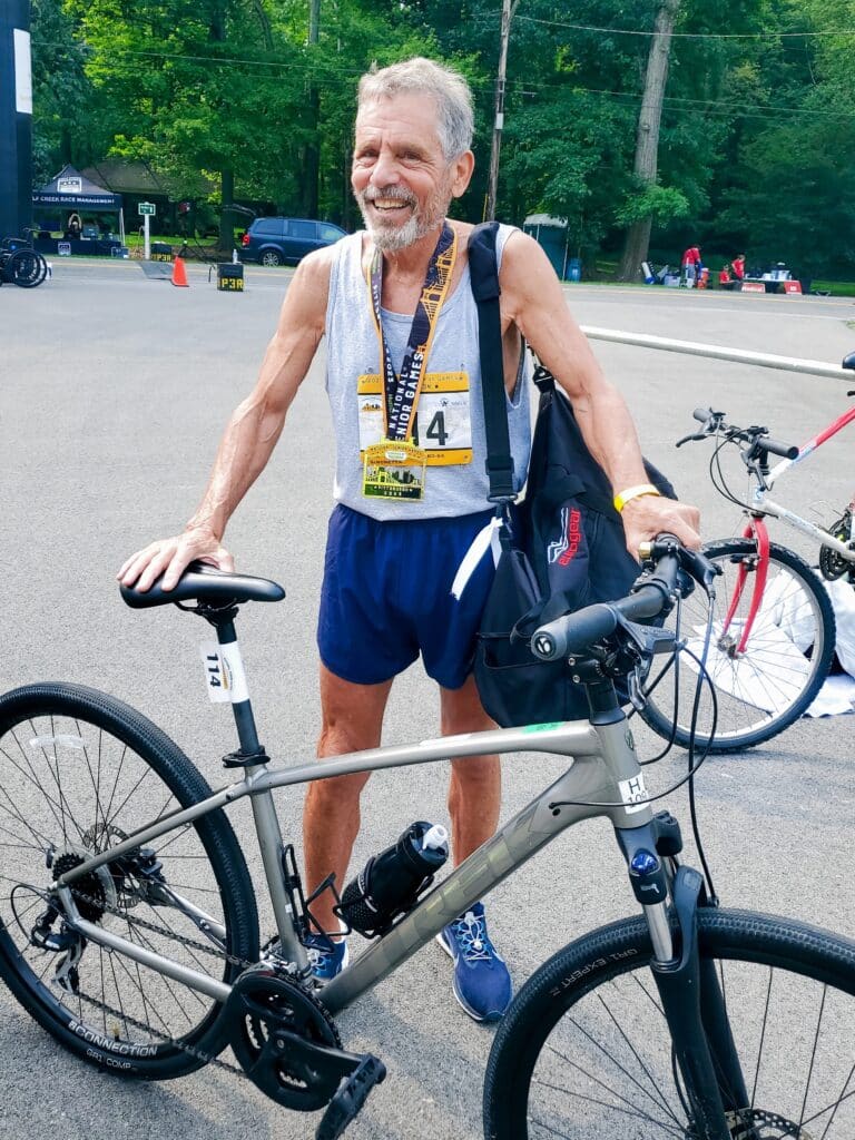 Joe Simonetta with his rented bike for the 2023 National Senior Games triathlon.
