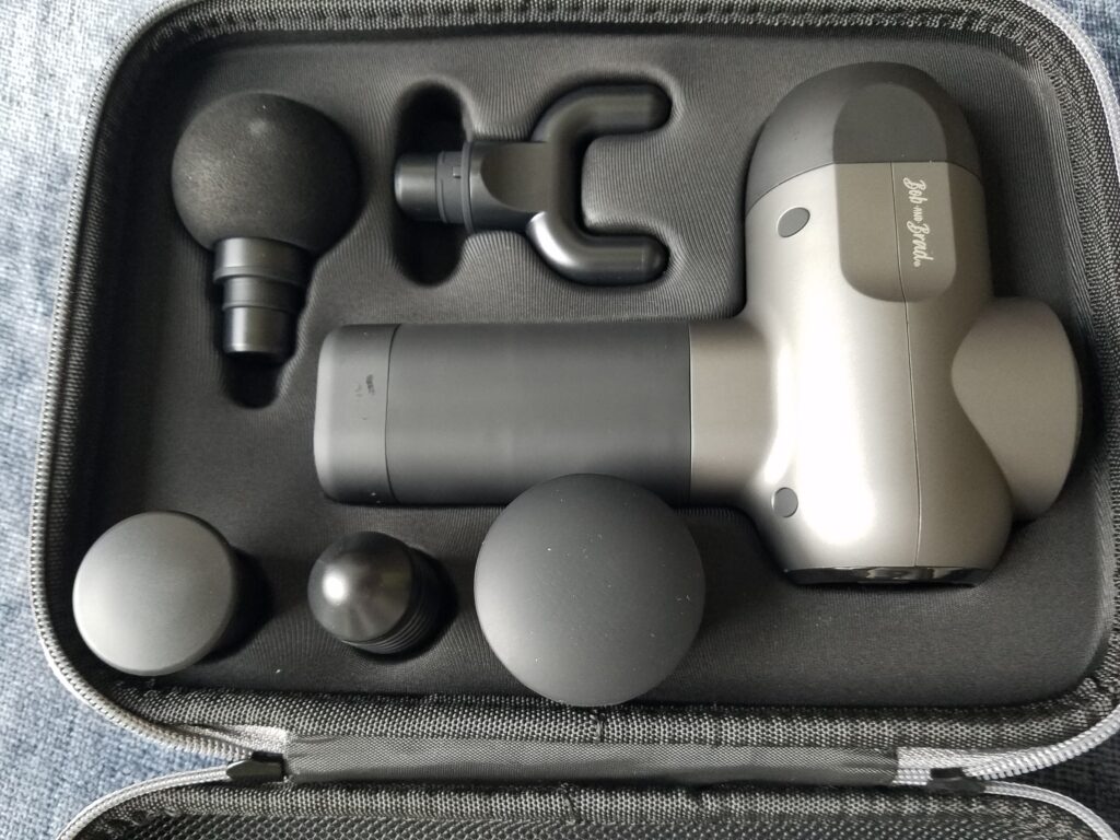 Foam rolling vs. massage gun. Picture shows the Bob and Brad C2 massage gun with its five head options.
