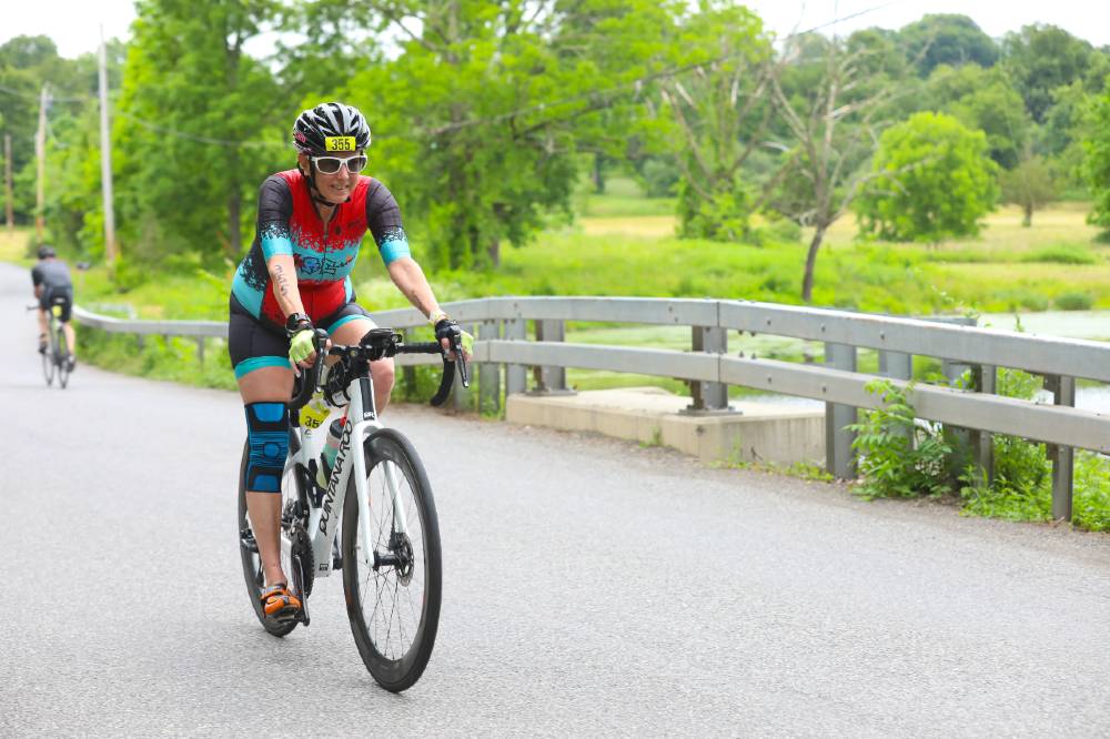 Hilary Topper on bike in a triathlon