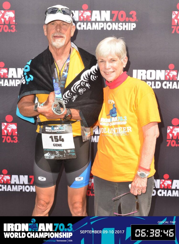 Gene and Kitty Peters smile together after an Ironman 70.3 World Championship event, reflecting the partnership that supported Gene's triathlon career.